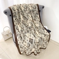 Beige cotton linen paisley scarf with brown borders draped over a chair for styling - Brown Border (LM394-2)