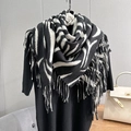 Zebra print scarf with long fringe details shown styled on a black sweater - 100x100cm / Black And White Zebra