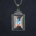 Blue Buddha Thangka pendant necklace in a grey metal scrollwork frame with steel chain - Acala (Rooster) / Pendant And Chain / Black