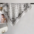 Elegant white square scarf with black paisley and star patterns on a metal display stand - Square Style / White