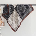 Bohemian paisley print cotton linen scarf with caramel trim hanging on a black rod - Square / Black