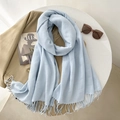 Soft light blue faux cashmere scarf with tassels styled on a light background - 65*200cm / Sky Blue