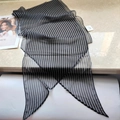 Macro shot of 100% silk black and white striped scarf with refined pointed ends - Black Stripe