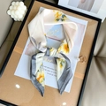 Elegant silk scarf featuring yellow floral patterns on a cream base with grey border - Blue Edge