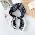 Detail of silk cotton blend paisley square scarf with knotted texture on aesthetic props - 65x65cm / Black (Paisley)