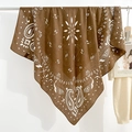 Brown bohemian paisley print square scarf in breathable linen-cotton hanging on metal rack - Brown