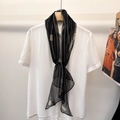 Classic black silk scarf with white polka dots and chain pattern tied on a white shirt - Dark Choco Chain