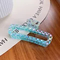 Iridescent light blue hair claw clip with faceted geometric design and holographic finish - 13cm / Metallic Blue