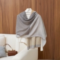 Elegant retro geometric print shawl in grey and orange draped on a mannequin - 180x85cm / Light Gray Vintage Plaid (LM218-2)