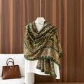 Deep green paisley shawl scarf in lightweight fabric draped on a fashion mannequin - 180x85cm / Green Paisley (LM329-1)