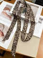 Leopard print pure silk skinny scarf displayed on fashion magazine for styling - Coffee Leopard
