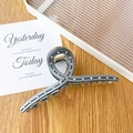 Dark grey twisted shark hair clip with sparkling rhinestones in a sleek minimalist design - Gray