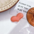 Detailed view of a heart-shaped pink resin hair accessory with translucent glossy finish - Pink (4.3cm)