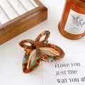 Elegant amber tortoiseshell butterfly hair claw clip with golden metal inner mechanism - Blue Brown