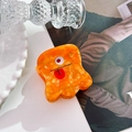 Pince à cheveux monstre en acétate orange avec œil et langue rouge pour style unique - Orange