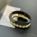 Oval hair claw clip in black resin finish with gold metal inner frame for women - Black (8.9cm)