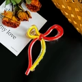 Elegante molletta per capelli a fiocco in acrilico trasparente con accenti rossi e gialli - Grande / Sfumatura Rosso Giallo