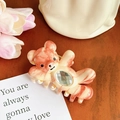 Claw clip featuring waving bear shape with orange marble finish and sparkling gem - Bean Paste Color-11cm