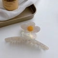 Floral acetate hair claw clip in creamy white with yellow center on a white background - Sunflower Bobby Pin