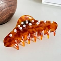 Large amber tortoiseshell hair claw clip with elegant pearl accents and resin finish - Large / Brown
