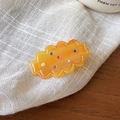 Translucent orange resin hair clip with colorful rhinestones in a wave design - Brown Duckbill Clip