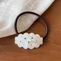 Sweet cloud hair tie with colorful rhinestones on a natural wooden background - Iridescent White Hair Tie