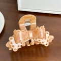 Elegant amber acetate shark hair clip with layered bow design and lace-like cutouts - Medium / Colorful Orange