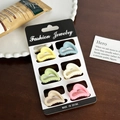 Set of six colorful macaron heart hair clips in matte finish on a display card - Set 4