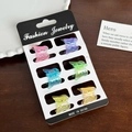 Lot de 6 mini pinces à cheveux papillon aux couleurs irisées sur une carte de présentation - Design Papillon