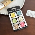 Set of 6 colorful daisy hair clips in matte macaron shades on a display card - Set 13