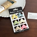 Set aus 6 matten Mini-Blumen-Haarspangen in Makronenfarben auf einer Karte - Blumen-Stil / Set 16
