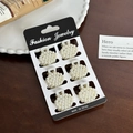 Set of 6 mini pearl claw hair clips with elegant white beads on a black jewelry card - Set 8