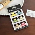 Set of 6 small macaron matte hair claws in various pastel colors on display card - Set 11