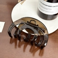 Large amber brown translucent claw clip for thick hair shown on a wooden background - Gray (10cm)