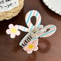 Pink and blue striped bow hair claw clip with floral accents on a wooden background - Pink Flower Stripes-9.3cm