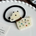 Chic dog hair tie with cream acrylic puppy and colorful crystals on a black elastic band - Creamy White Hair Tie