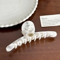 French vintage marble white hair claw clip with golden metal logo on wooden surface - Marble White Barrette (12.1cm)