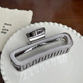 Minimalist silver rectangular metal hair claw clip with a glossy mirror finish on a ceramic plate - Rounded Square Claw Clip - 13cm