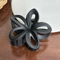 Matte black plumeria flower hair claw clip with cutout petals for elegant hair styling - Black / 7.9cm
