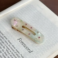 Fermaglio ovale in acetato marmorizzato con strass colorati e base dorata - Ciano Iridescente