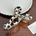Retro cow print large hair claw clip with gold alloy frame and black white patterns - Bow Style