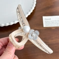 Elegant cream shell hair claw with pearl and camellia flower detail in a Korean style - Off-white Camellia Style
