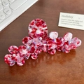 Red and white marble pattern flower hair claw clip with rhinestones on wooden background - Cherry Red