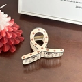 Elegant beige hair claw clip featuring red floral patterns and polished finish - Flower (Small)