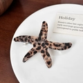 Starfish acetate hair clip with leopard print texture on a decorative white plate - Cream Tortoiseshell-7.5cm