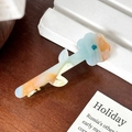 Floral acetate hair clip with blue and orange marbling and a teal rhinestone center - Blue Brown