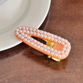 Elegante fermaglio in resina arancione con doppia fila di perle su base dorata - 6.6cm / Arancione