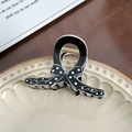 Elegant black hair claw clip with white polka dot bow design in a ceramic tray - 8.1cm / White Polka Dot Small