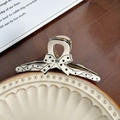 Polka dot bow claw clip in cream white with black patterns for elegant hairstyles - Black Polka Dot Medium