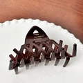 French vintage dark brown acetate claw clip with hollow lattice design and gold logo - 9.1cm / Dark Coffee
